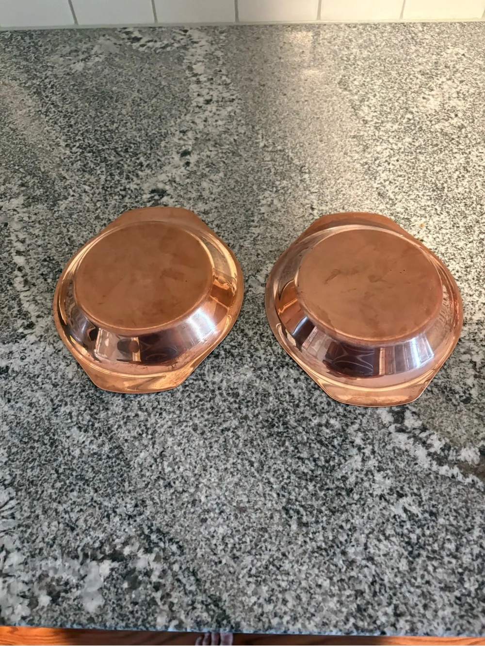 Set of two copper coated oval bowls